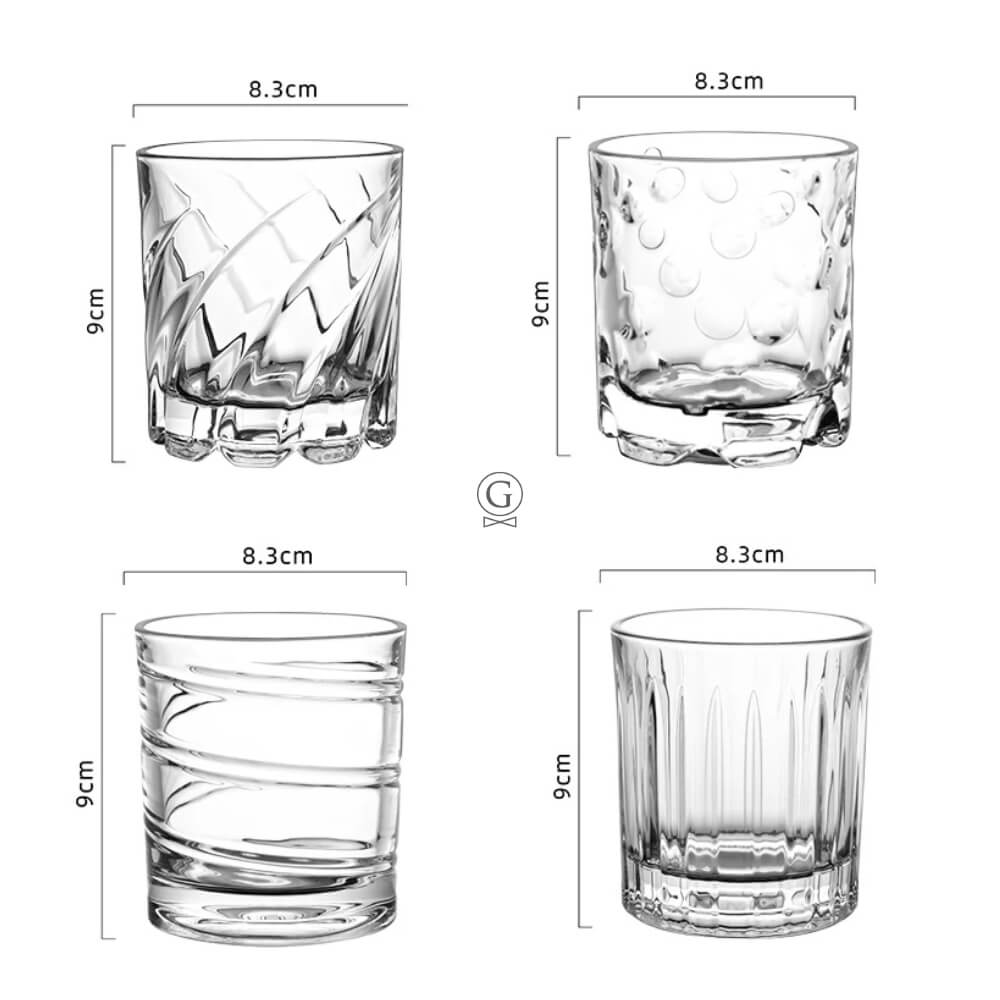 Four clear glass tumblers with measurements on a white background