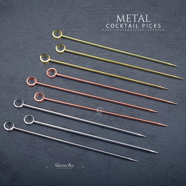 Gold plated cocktail pick detail